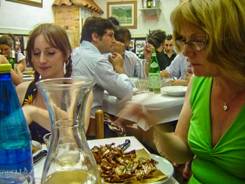 TheDiners enjoying carciofi alla giudia (fried artichokes) at Sora Margherita in Rome