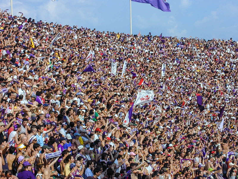 ACF Fiorentina fans weating the viola (purple) on the Curva Fiesole of the Florence soccer stadium. (Photo by Pedro Varela6)