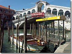 A taxi acquei (water taxi) stand near the Rialto Bridge in Venice